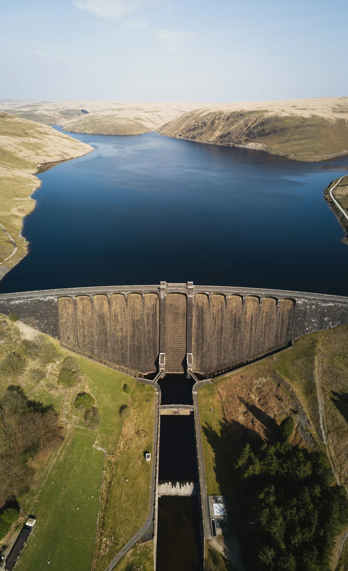 Aerial view of a dam and reservoir in Elan Valley, Wales.